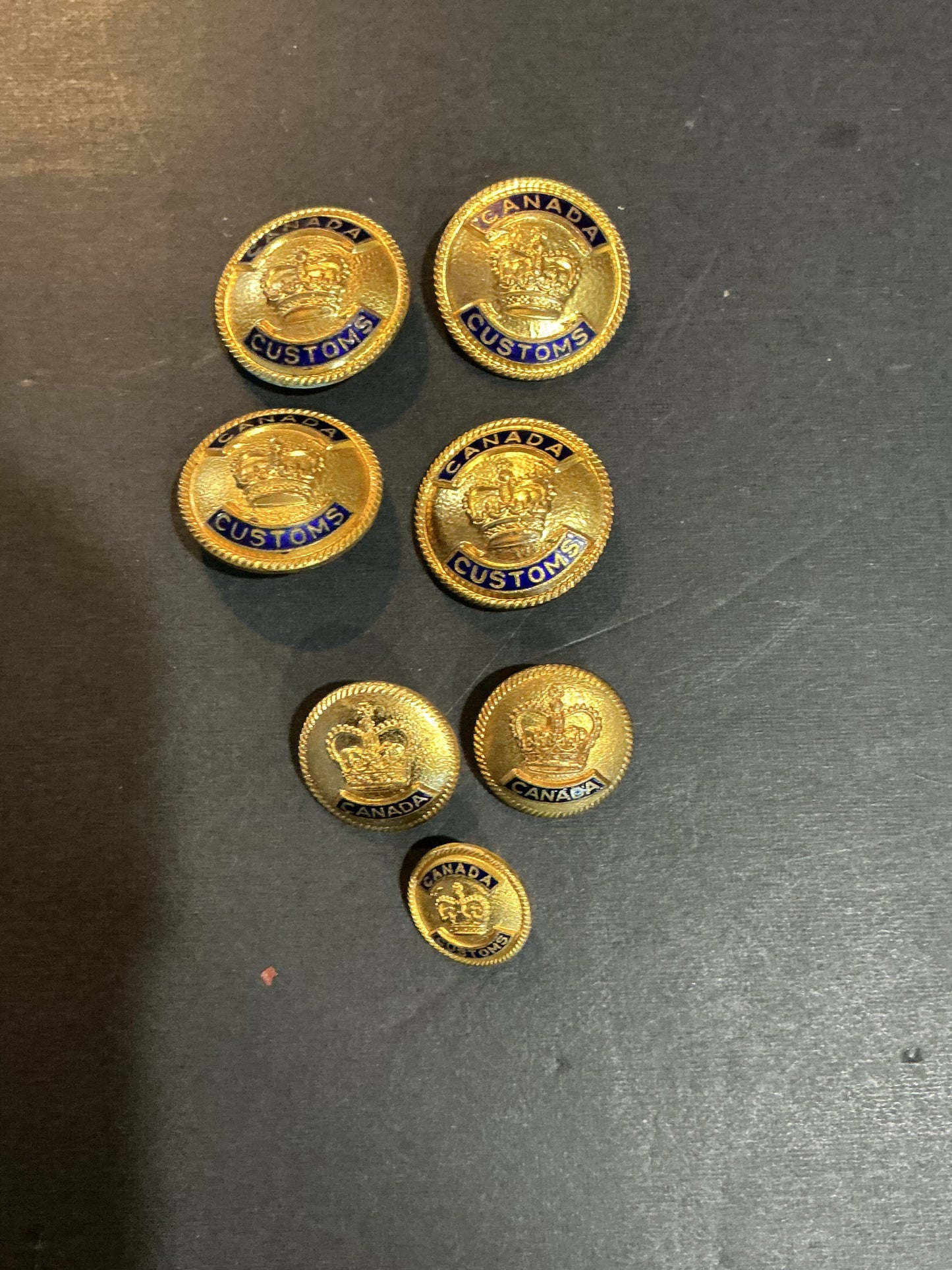 Lot of 7 Canadian Customs Medal Buttons