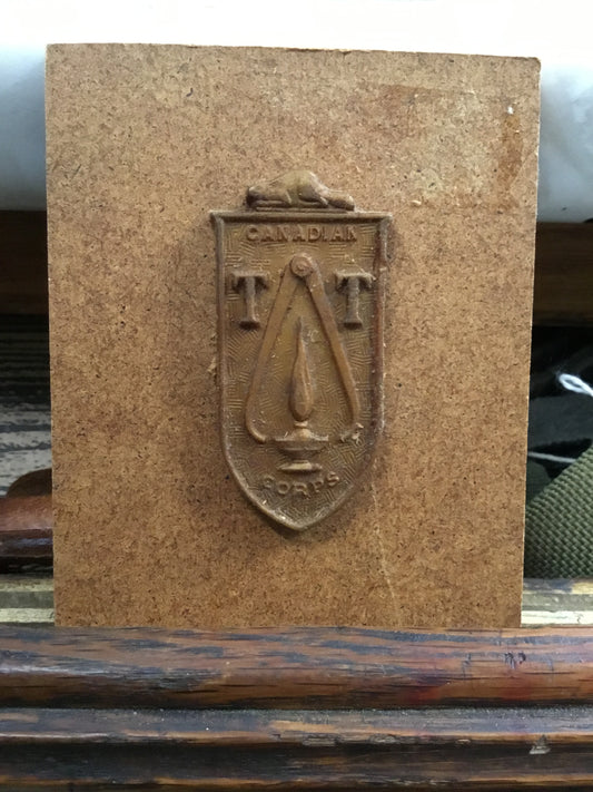 Canadian Technical Training Corps cap badge in Bakelite/plastic.