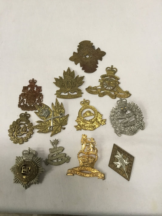 Lot of 11 Post War Canadian military Badges ( IN NEED OF REPAIR)