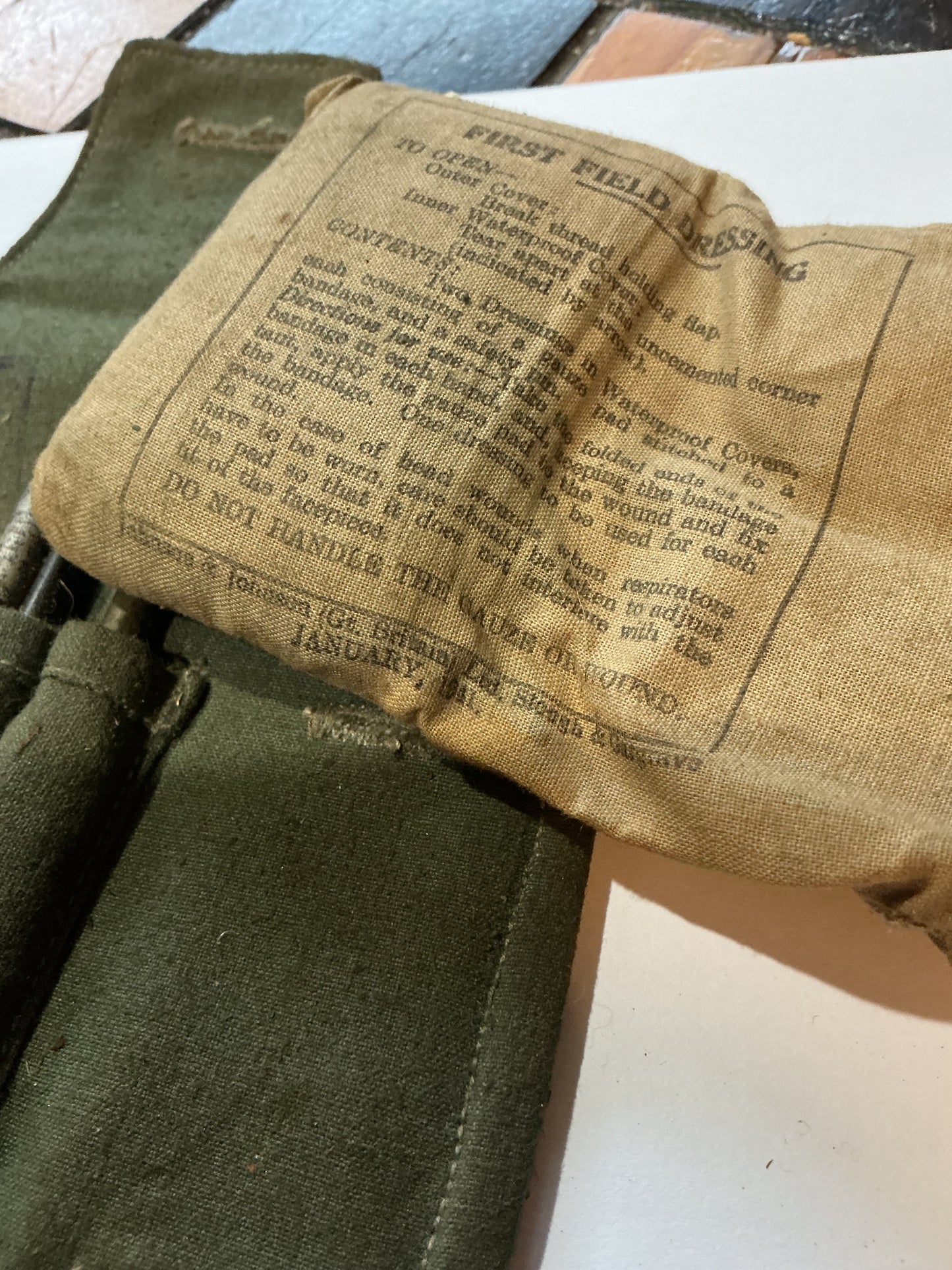 WW11 partial Field Dressing 1941 , and Mosin-Nagant cleaning and tool kit