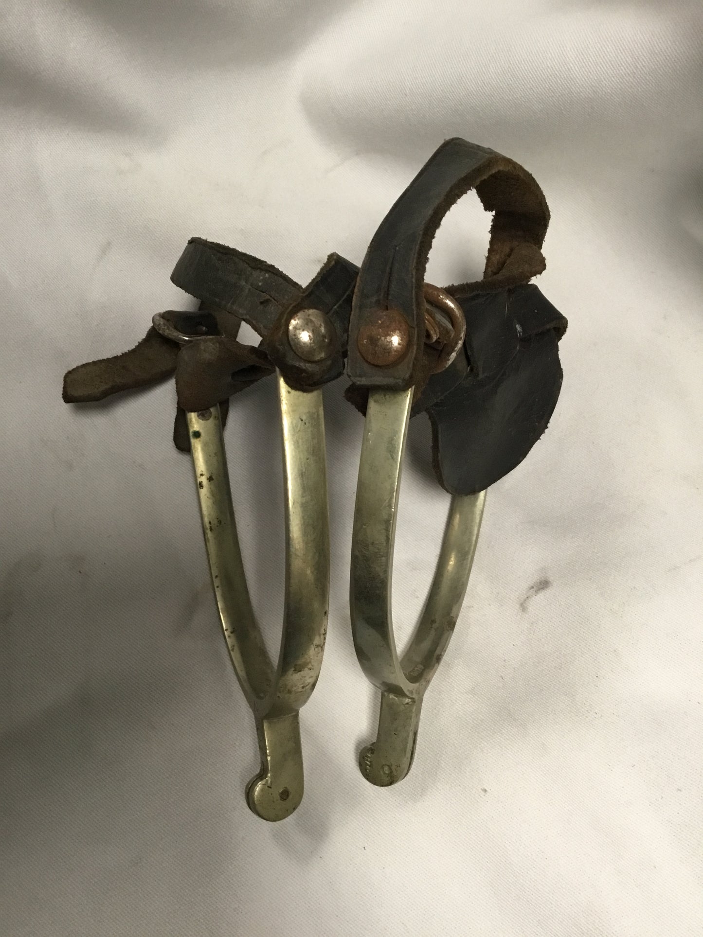 Early pair of spurs with leather boot straps